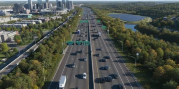 Modern multi-lane highway in the USA with diverse landscape