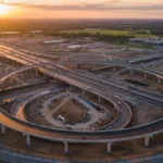 Modern highway interchange under construction, symbolizing infrastructure progress.