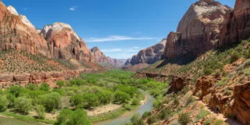 Panoramic view of Zion National Park in spring with green trees and red cliffs